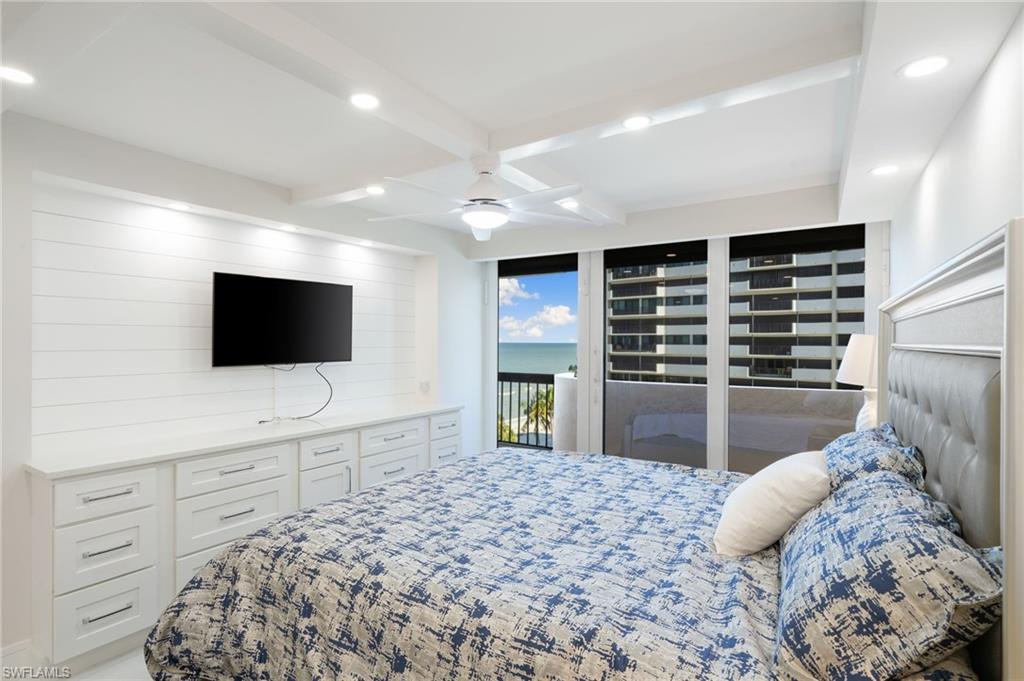 Bedroom with ceiling fan, access to outside, and beamed ceiling