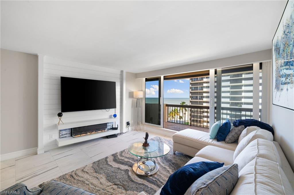 Tiled living room featuring a fireplace