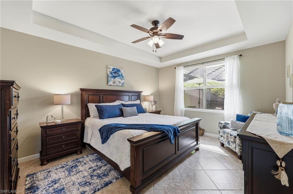 Primary Bedroom with space for a king-size bed and neutral tones that complement the tile flooring.