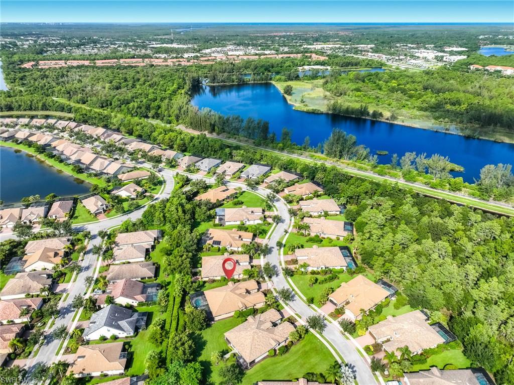 Aerial perspective showcasing a residential community with lush preserve landscaping