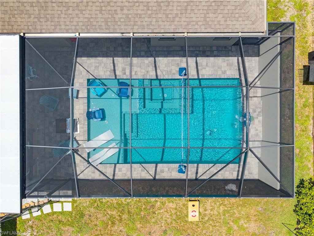 Aerial view highlighting the custom pool, cabana, and backyard design—perfect for buyers searching for luxury outdoor living in Cape Coral.