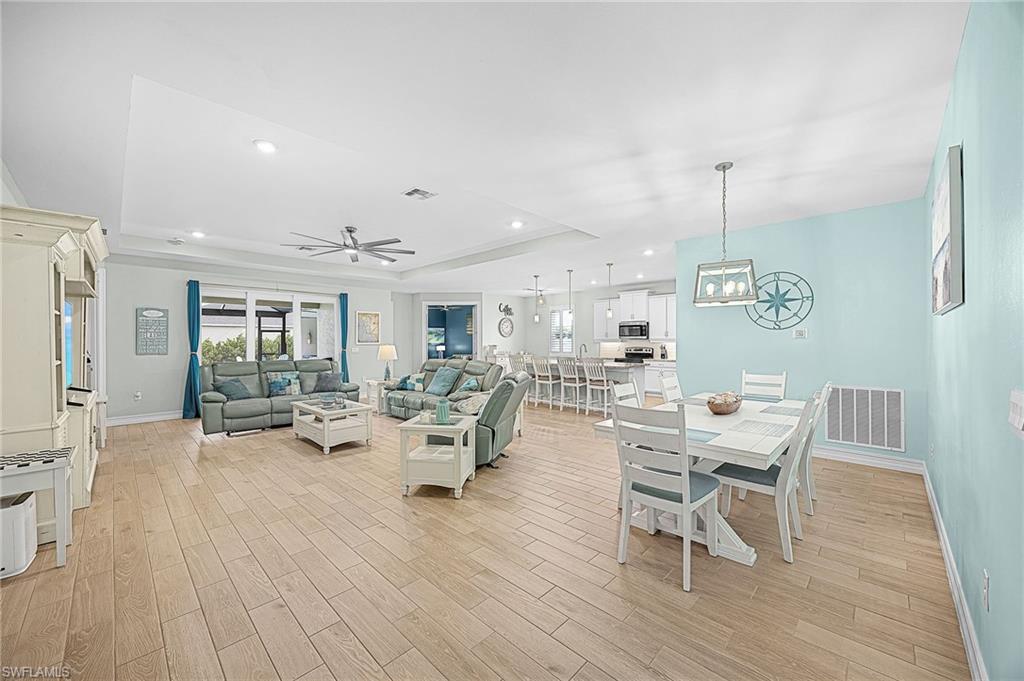 Open-concept living area designed for modern Florida living, offering seamless flow between the kitchen, dining, and living spaces—perfect for entertaining or everyday comfort.