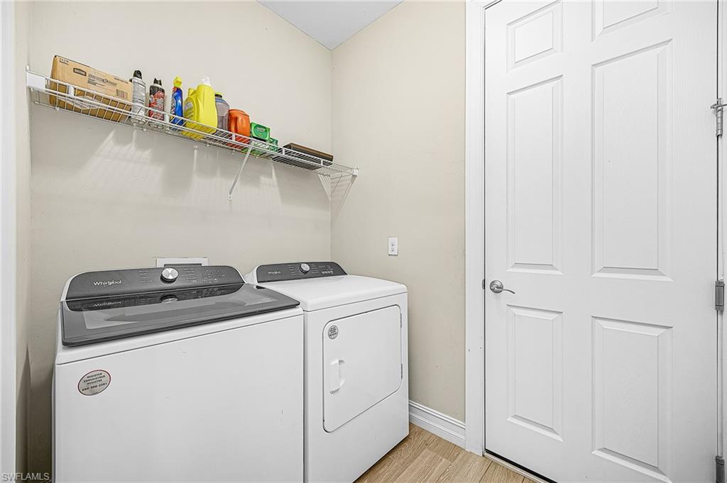 Laundry room with additional storage closet, designed for convenience and organization.