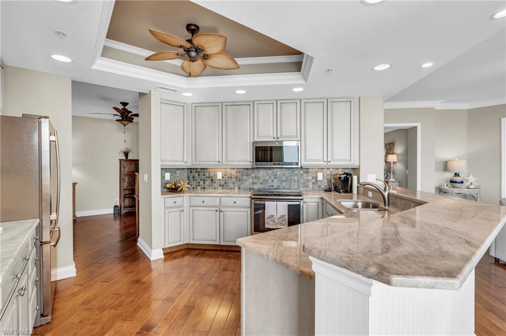 Kitchen featuring Granite Countertops, newer appliances and the entrance to the Den area