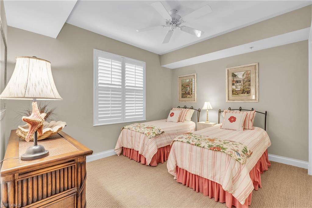 Guest Bedroom with carpet floors and ceiling fan