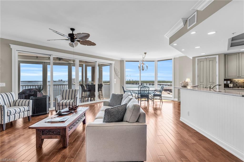 Living room with ceiling fan with the new hardwood flooring