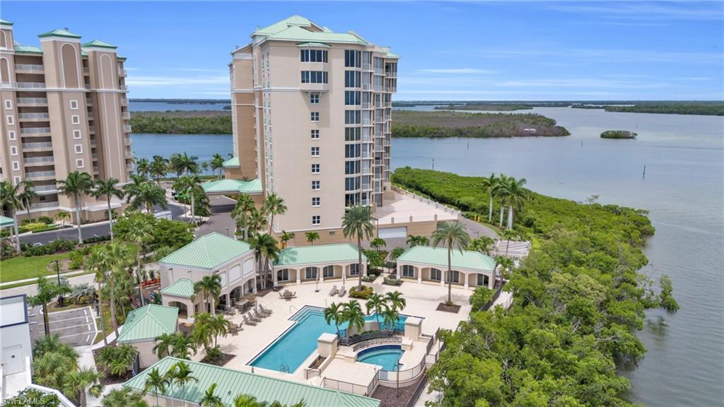 Birds eye view of property featuring a water view