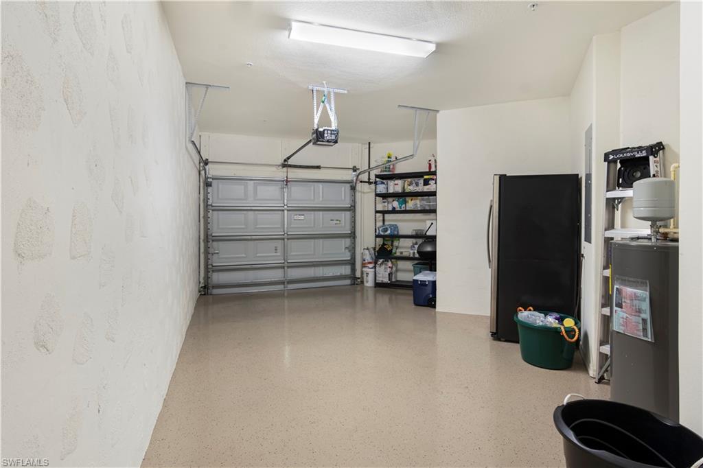 Garage featuring black refrigerator