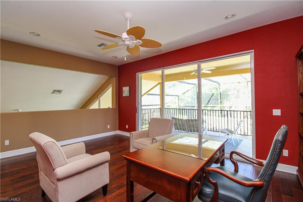 Office area with plenty of natural light, dark hardwood / wood-style floors, and ceiling fan
