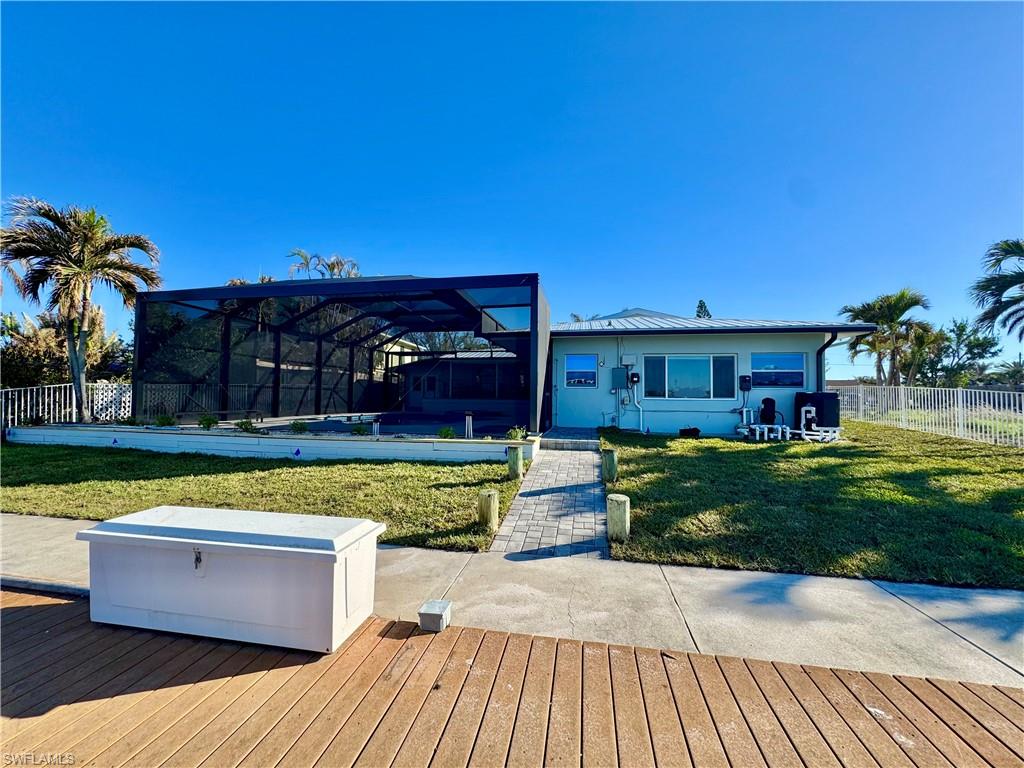 Deck with glass enclosure and a yard
