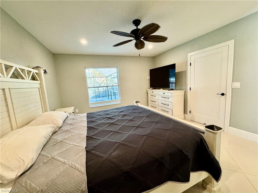 Bedroom featuring ceiling fan and light tile patterned floors