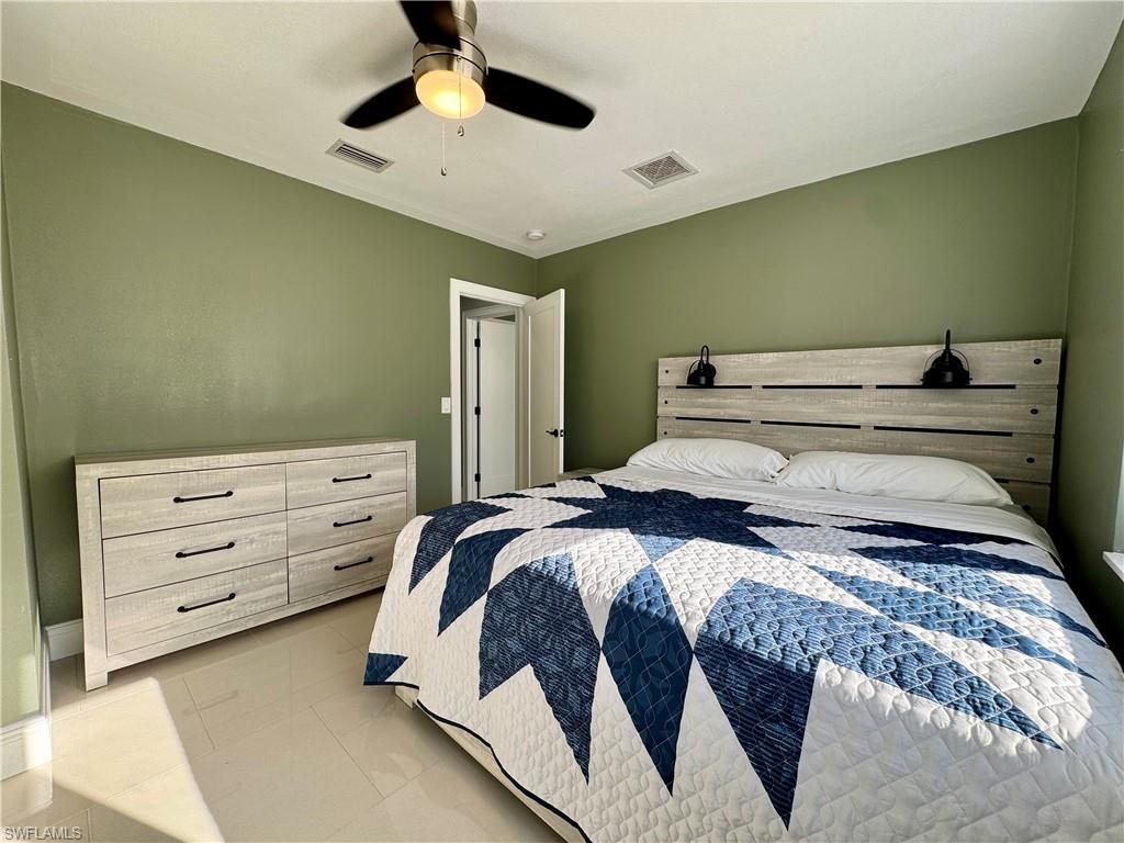 Bedroom featuring ceiling fan and light tile patterned floors
