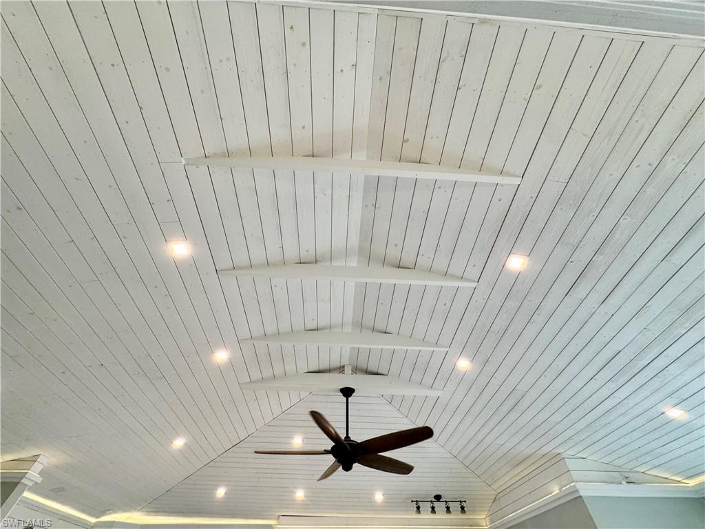 Details featuring ceiling fan and wood ceiling