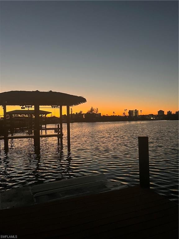 Dock area featuring a water view