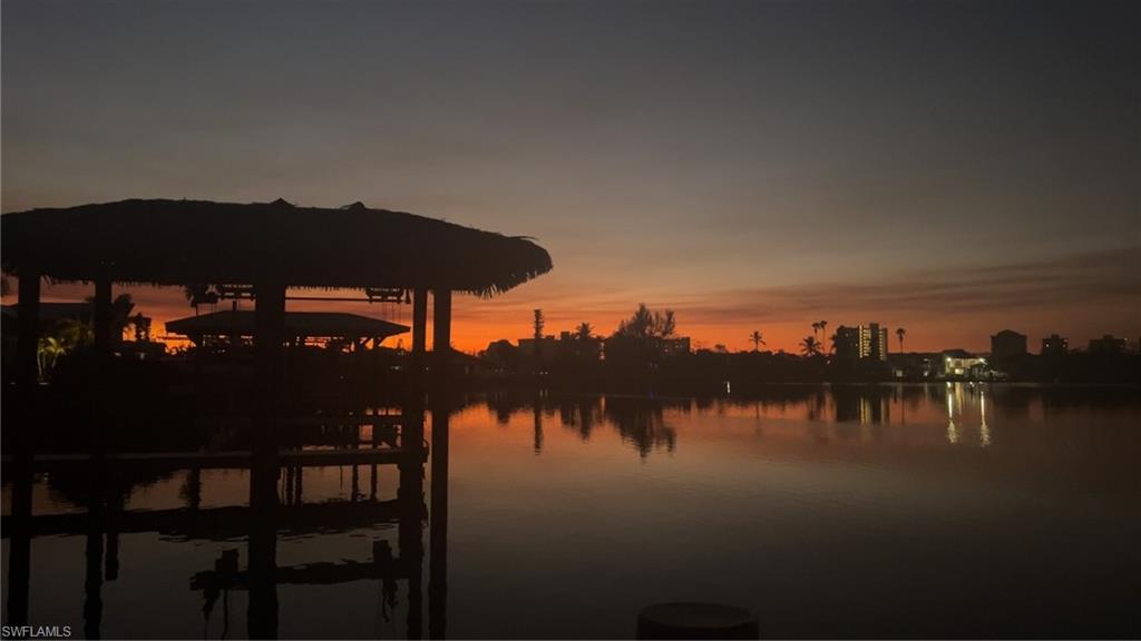Property view of water featuring a dock