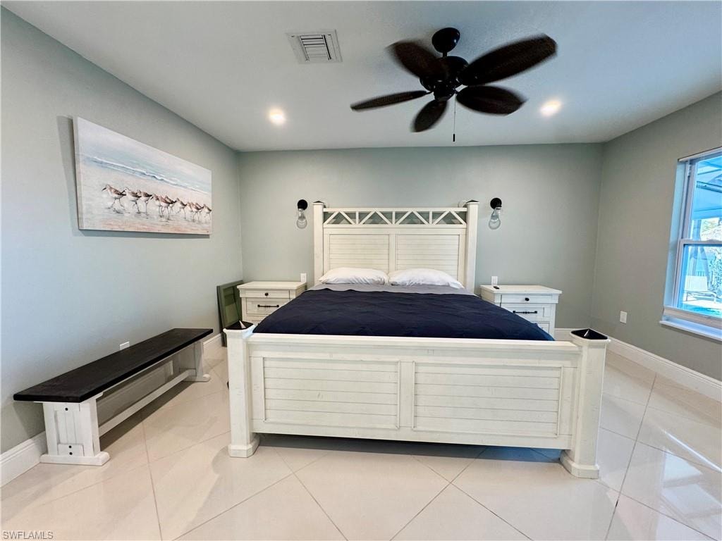 Unfurnished bedroom featuring ceiling fan and light tile patterned floors