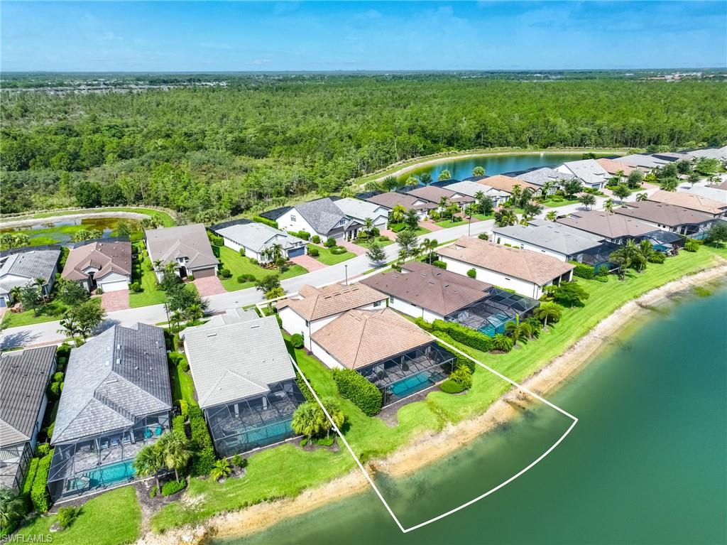 Waterfront property featuring a screened-in swimming pool and private lanai
