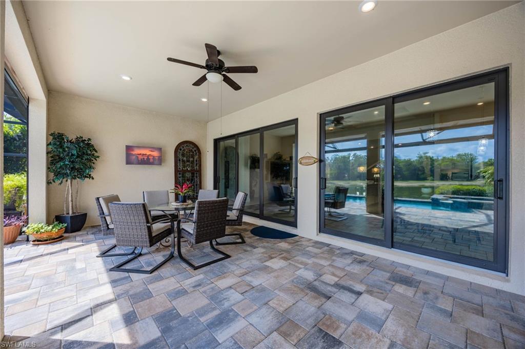 Covered patio featuring  electric storm shades to completely enclose area