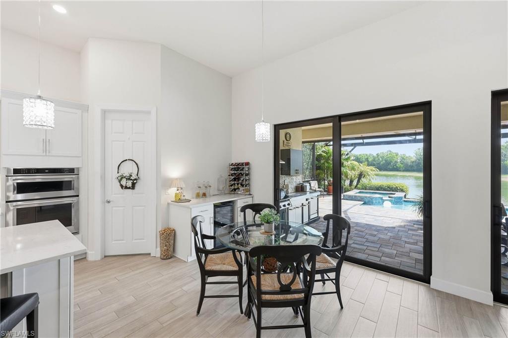 Bright breakfast area with beautiful views of the outdoor living  space and sunrise lake views