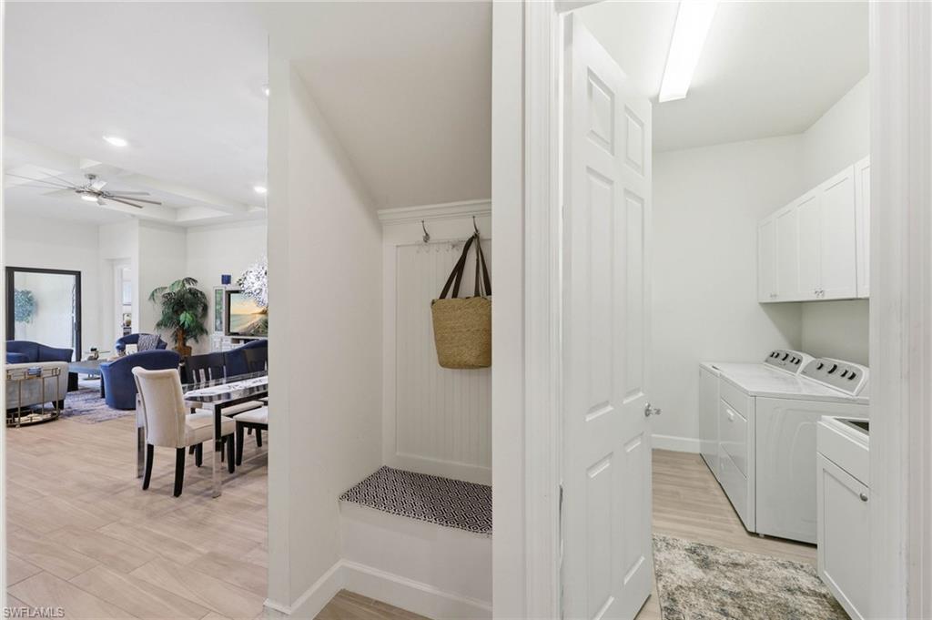 Laundry room with large sink and storage cabinets,  drop zone near rear garage entrance