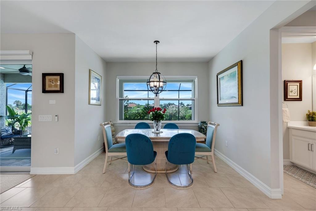 KITCHEN TABLE AREA OVERLOOKING THE POOL
