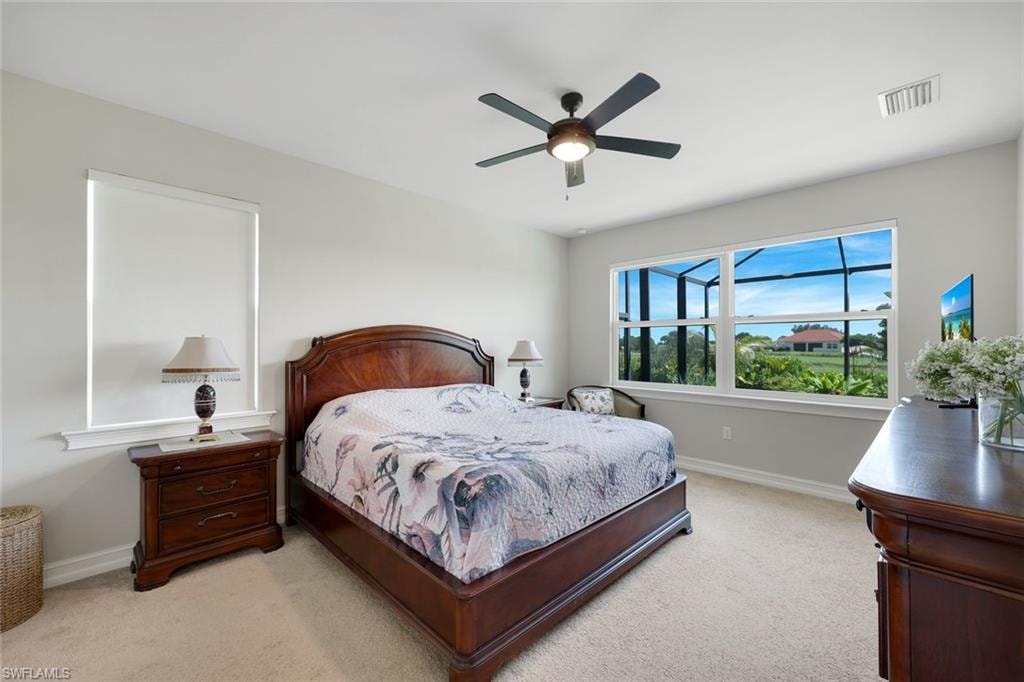PRIMARY BEDROOM OVERLOOKING THE POOL