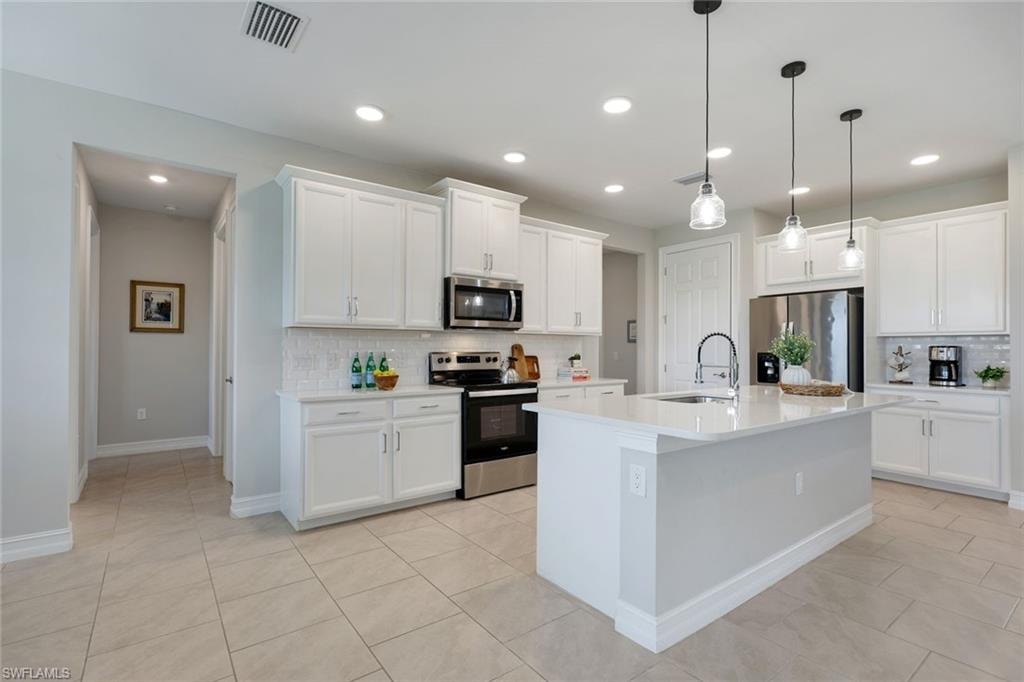 BEAUTIFUL KITCHEN WITH QUARTZ COUNTERS AND STAINLESS STEEL APPLIANCES