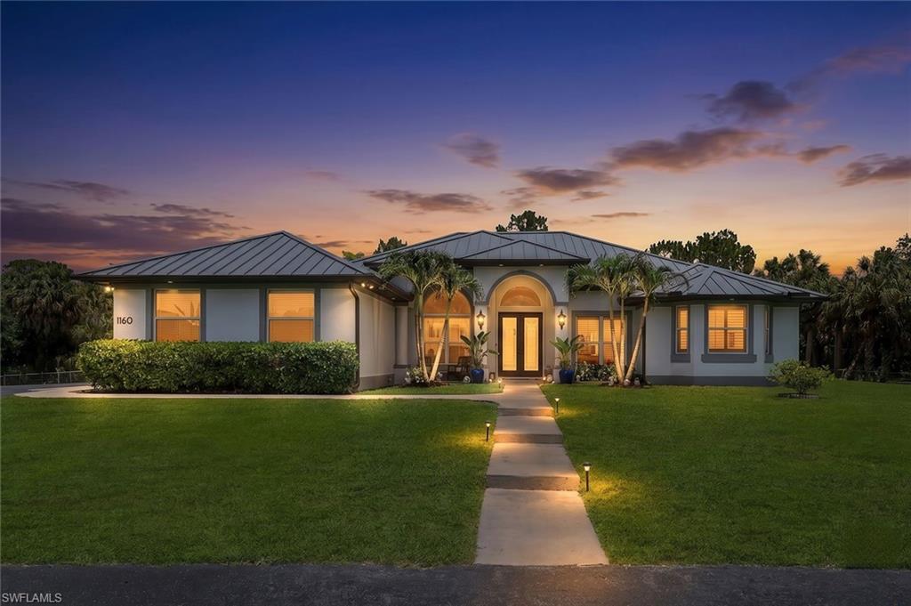 Twilight view of front of Main House