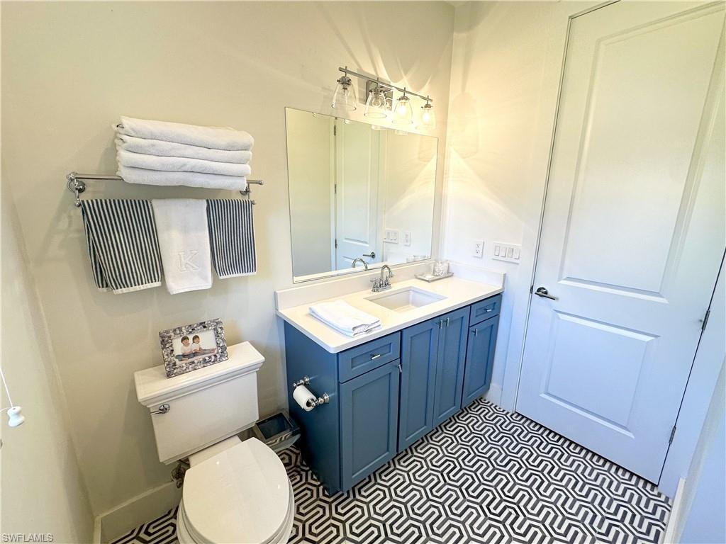 Bathroom featuring vanity and toilet