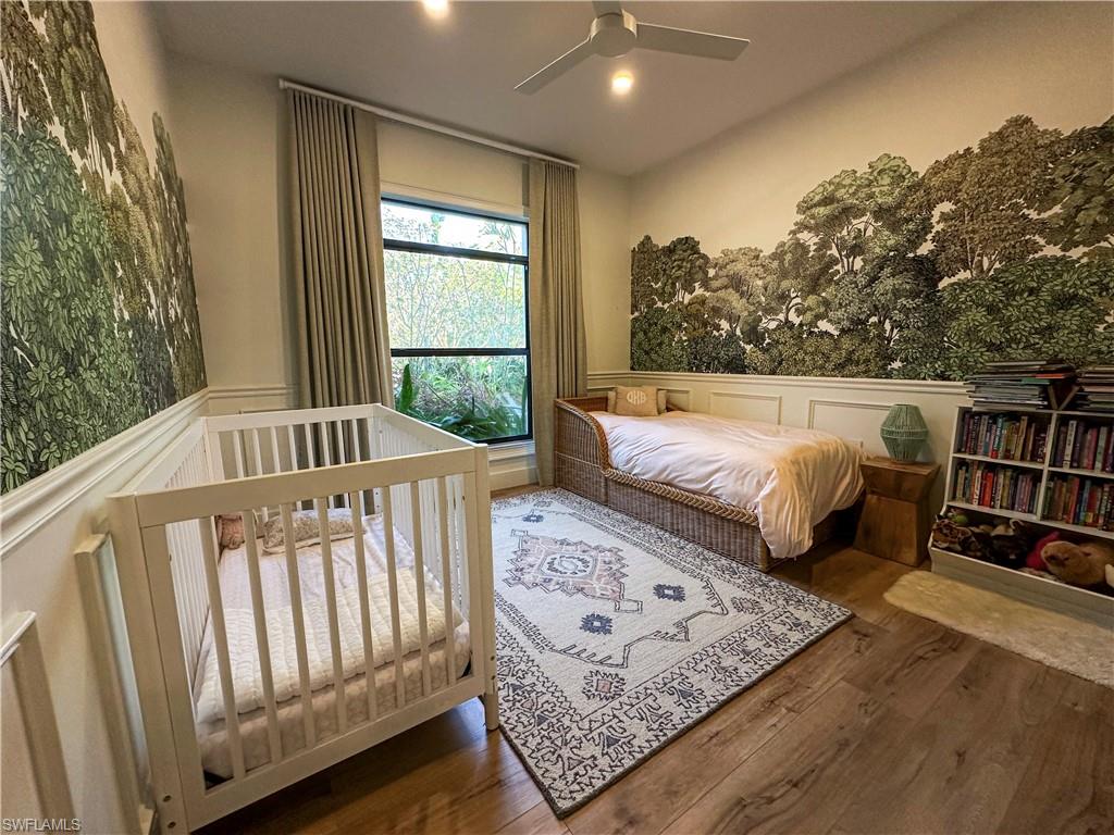 Bedroom with wood-type flooring and ceiling fan