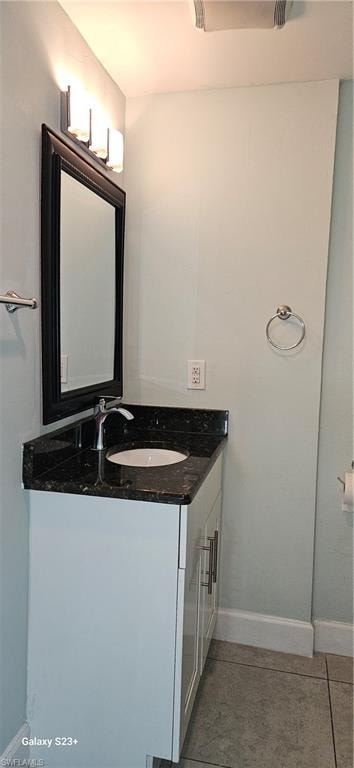 Bathroom with vanity and light tile patterned floors