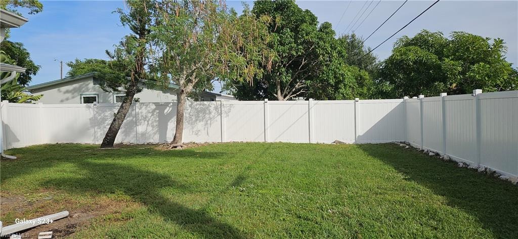 View of fenced backyard