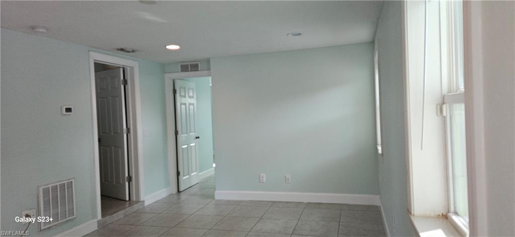 Spare room featuring light tile patterned floors and recessed lighting
