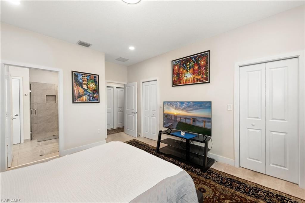 Bedroom featuring light neutral walls and recessed lighting