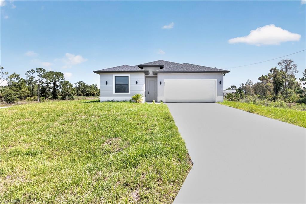 Modern exterior featuring light gray stucco siding, dark gray shingle roof, and a prominent attached garage with a painted concrete driveway
