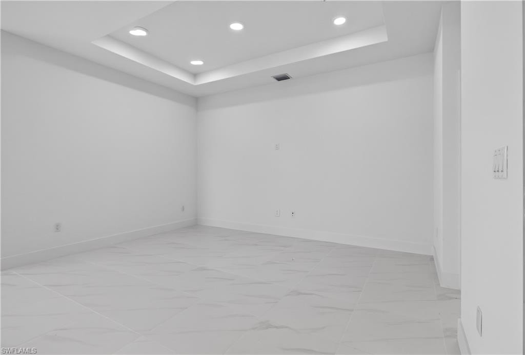 Recessed ceiling with integrated lighting, offering a contemporary aesthetic