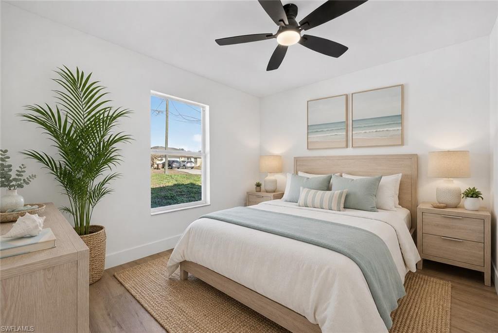Guest Bed with New Wide Plank Vinyl Floors and a Modern Fan