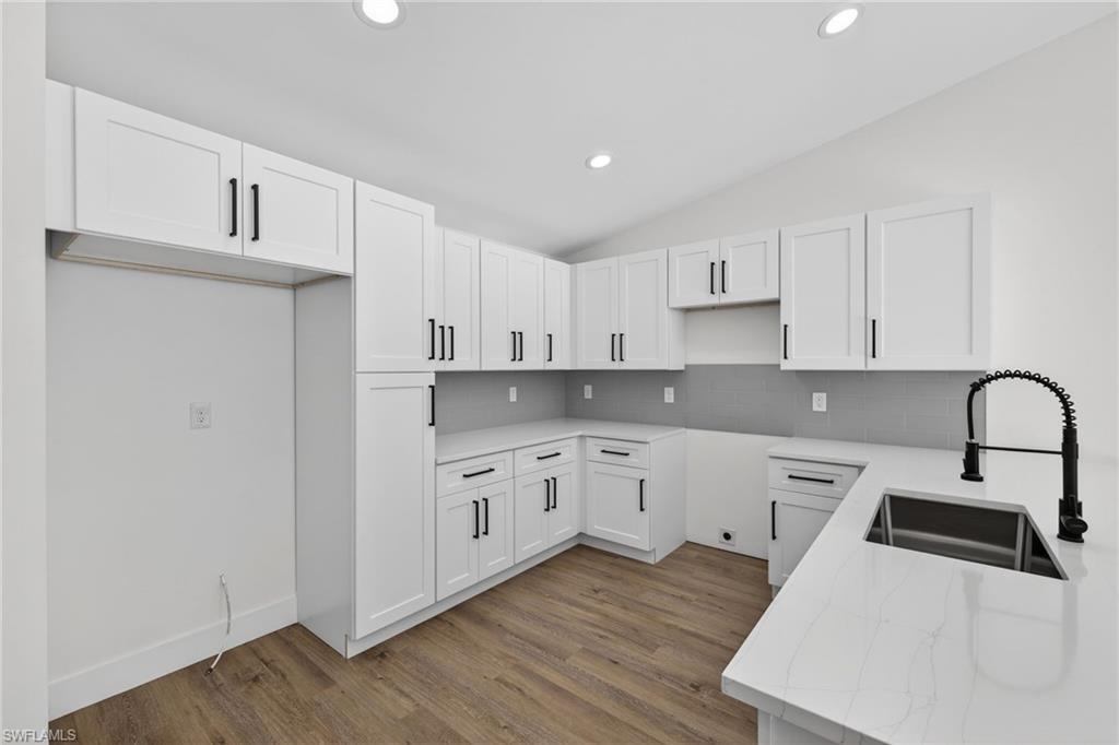 White Shaker Soft Close Cabinets with Black Hardware