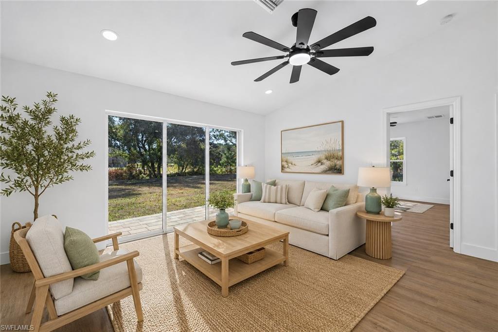 Living Room with Vaulted Ceilings & Large Modern Fan