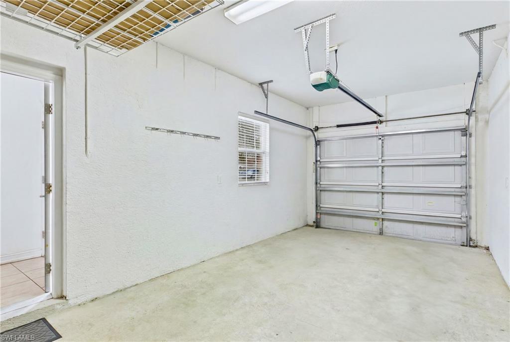Attached 1-car garage offering secure parking and additional storage space.