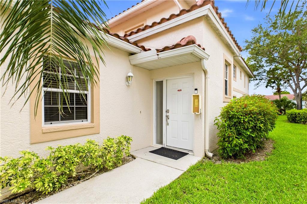Inviting front entrance welcomes you into this spacious Naples condominium.