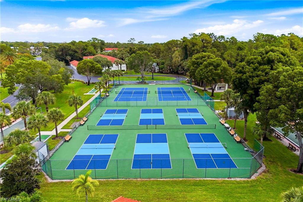 Aerial view showcasing the community's impressive recreational amenities, including pickleball, tennis, and shuffleboard courts.
