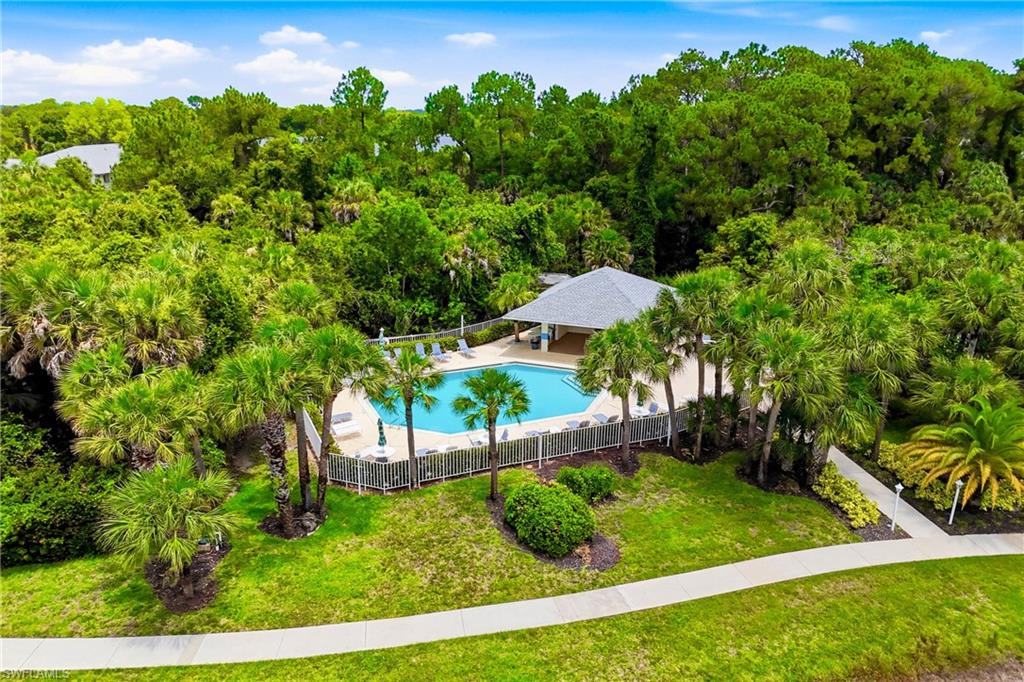 Elevated view of the community's additional pool, surrounded by mature landscaping and designed for year-round enjoyment.