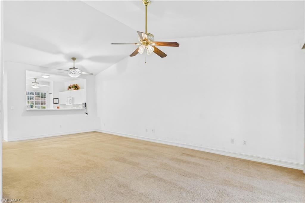 Spacious living room filled with natural light, creating a warm and inviting atmosphere for relaxing or entertaining.