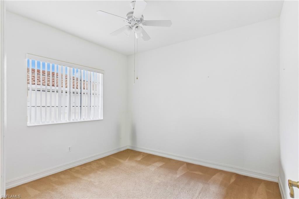 Spacious guest bedroom offers comfort and privacy for family and visitors.