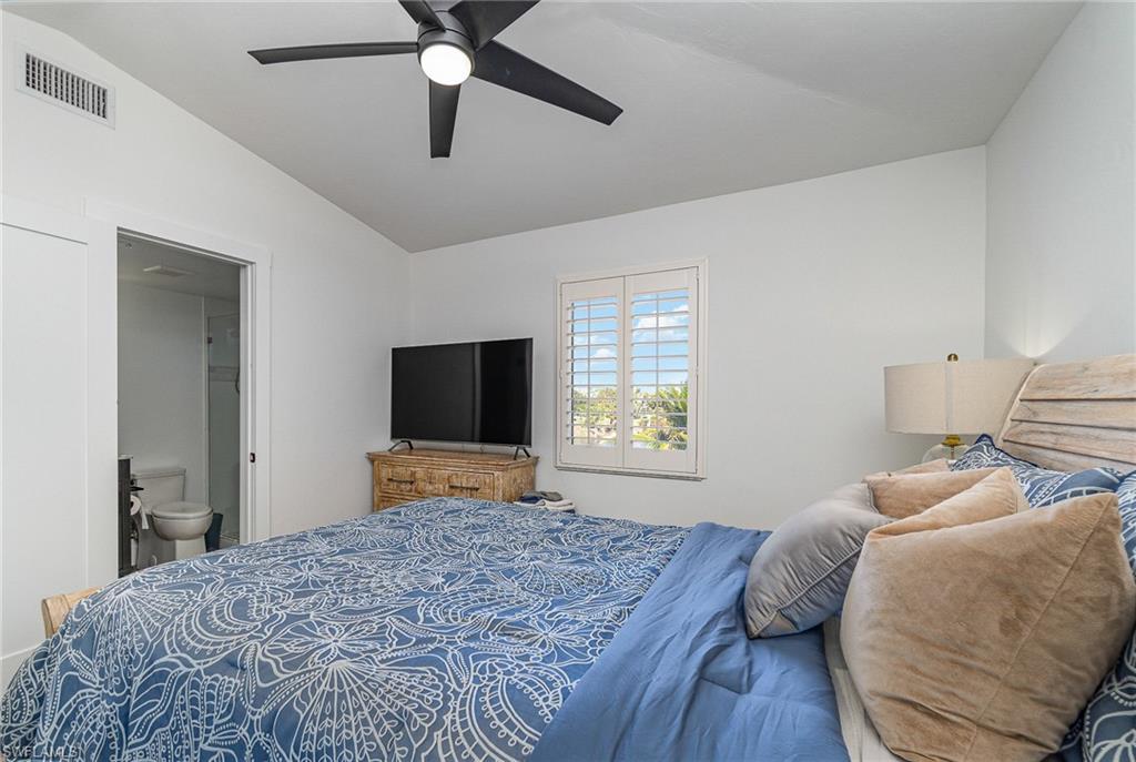 Bedroom featuring a vaulted ceiling and a ceiling fan