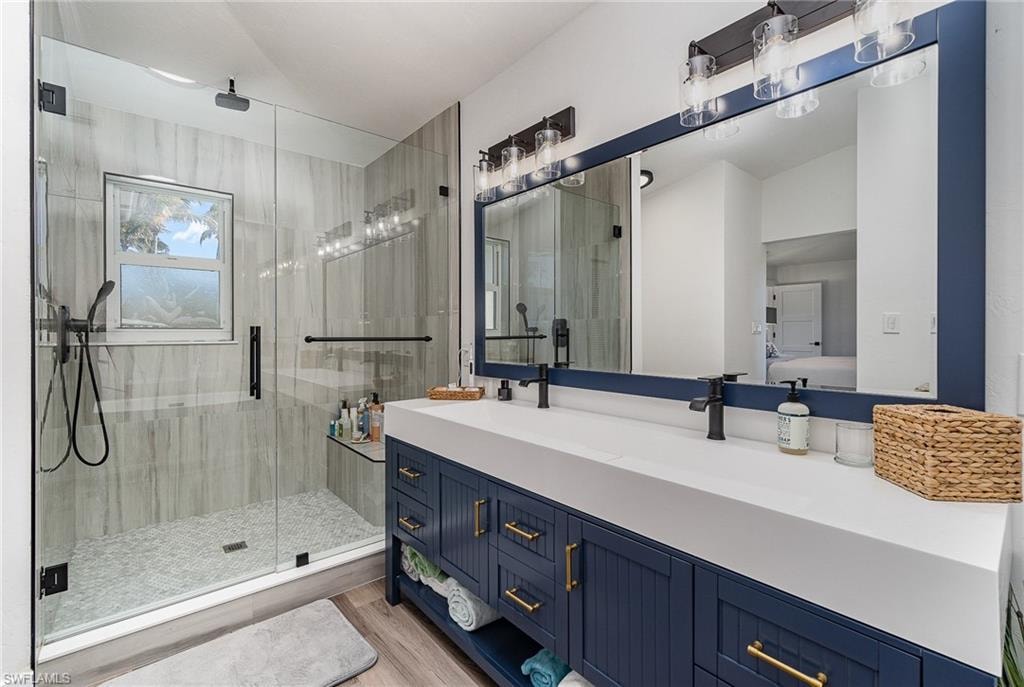 Contemporary bathroom featuring a spacious glass-enclosed shower with tile surround, a built-in shower niche, and a window