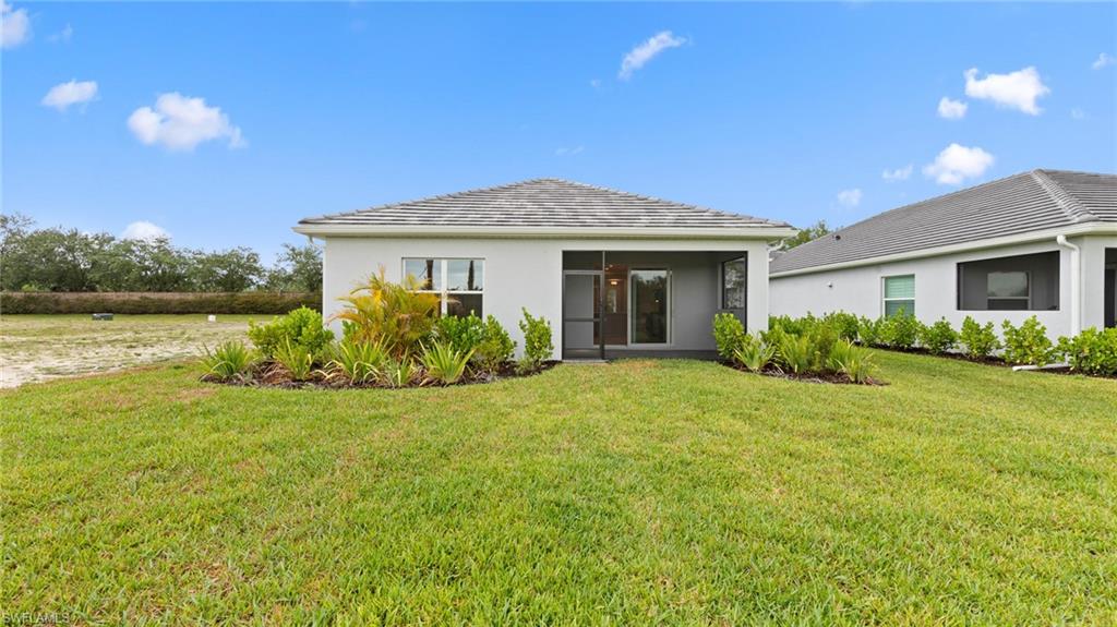 The backyard is pool-ready with a pool pre-wire package and ample room for a custom pool, set against a private preserve backdrop and manicured landscaping.
