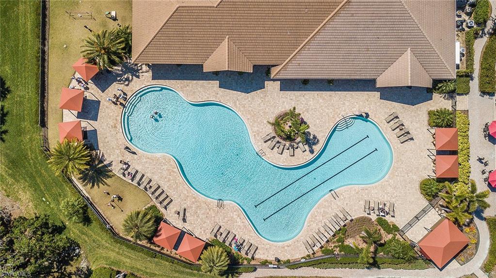 A lagoon-style resort pool and expansive sundeck anchor Verandah's amenity center from above.