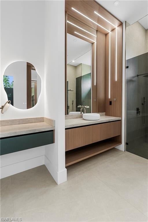Contemporary bathroom featuring light-toned large format floor tiles